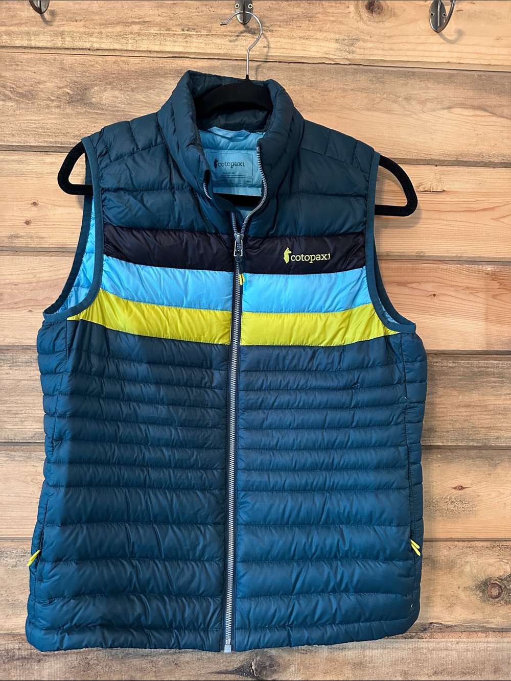 cotopaxi Teal Puffer Vest with Blue and Yellow Stripes